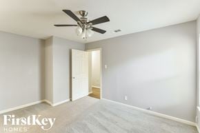 Dallas house for rent - the master bedroom has a ceiling fan and a carpeted floor