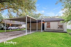 Pearland house for rent - A house with a carport attached to it.