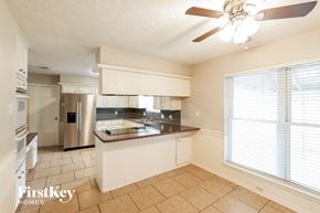Spring house for rent - a kitchen with a large window and a counter top