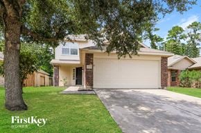 Houston house for rent - A house with a tree in front of it.