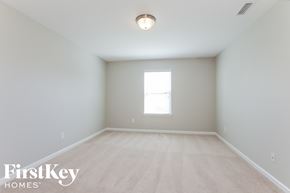 Charlotte house for rent - a spacious room with white walls and a window