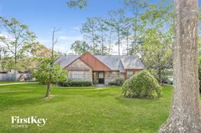 Oak Ridge North house for rent - a house with a yard and trees in front of it