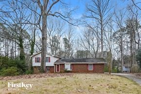 Marietta house for rent - a small red brick house in the middle of the woods