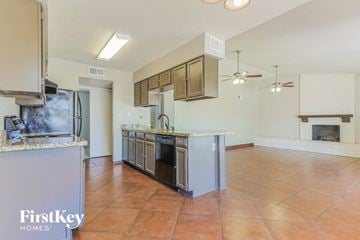 Chandler house for rent - a kitchen and living room with a stove and a refrigerator