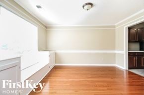 Memphis house for rent - a empty dining room with wood floors and white walls