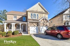 Atlanta house for rent - a home with a car parked on the driveway in front of it
