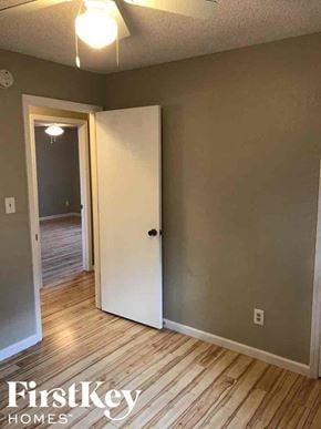 Blue Springs house for rent - an empty room with a door open to a hallway and a door into a bedroom