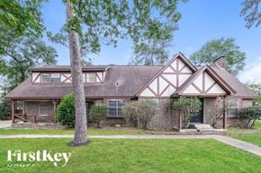 Oak Ridge North house for rent - front view of a brick house with white trim and a yard