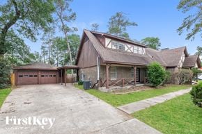 Oak Ridge North house for rent - a home with a garage and a driveway in front of it