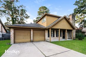 Spring house for rent - A house with a garage and a driveway is shown.