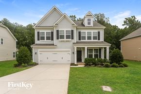 Monroe house for rent - A two-story house with a garage is for sale.