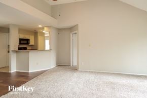 Katy house for rent - a living room with a carpet and a kitchen