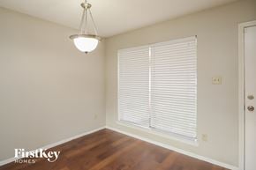 Katy house for rent - a living room with a large window and wood flooring