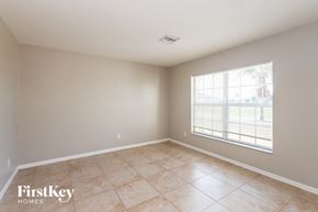 Cape Coral house for rent - the living room of an empty home with a large window