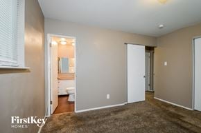 Florissant house for rent - a living room with a toilet and a door to a bathroom