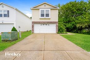 Indianapolis house for rent - A two-story house with a garage is for sale.