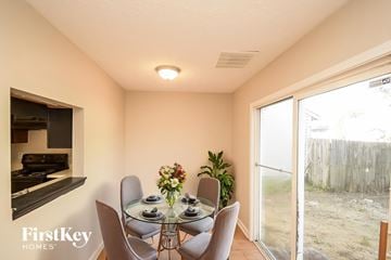 Indianapolis house for rent - A dining room with a glass table and chairs.