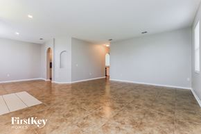 Lakeland house for rent - A spacious room with a tiled floor and a FirstKey Homes logo.