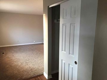 Fairfield house for rent - a bedroom with a white door open to a room with a carpet