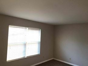 Fairfield house for rent - a living room with a window and gray walls