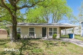 Florissant house for rent - A house with a tree in front of it.