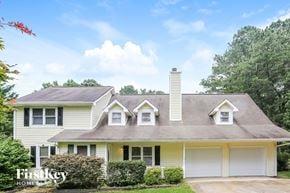 Austell house for rent - a white house with white shutters and a gray roof