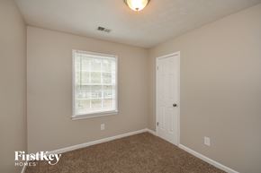 Conyers house for rent - a bedroom with a white door and a window