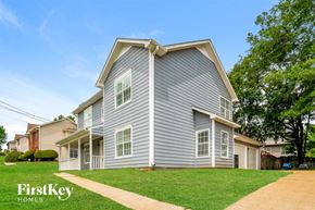 Helena house for rent - A house with a grey siding and a white trim is for sale by FirstKey Homes.