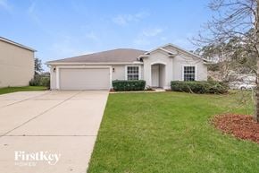 Middleburg house for rent - a white house with a driveway and a lawn
