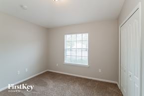Middleburg house for rent - a bedroom with carpet and a window and a closet