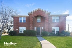 Lancaster house for rent - A brick house with a walkway leading to the front door.
