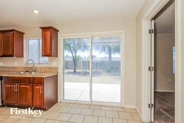 Phoenix house for rent - A kitchen with wooden cabinets and a sink is shown.