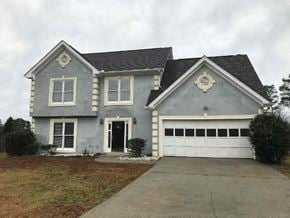 Lawrenceville house for rent - a gray house with a white garage door