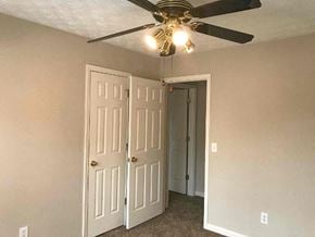 Lawrenceville house for rent - a bedroom with a ceiling fan and a closet