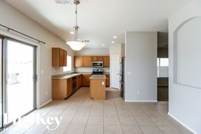 Queen Creek house for rent - a large kitchen with wood cabinets and tiled flooring