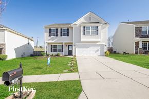 Dallas house for rent - a white house with a sidewalk in front of it