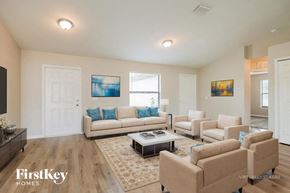 Lehigh Acres house for rent - A living room with a couch, chairs, and a coffee table.