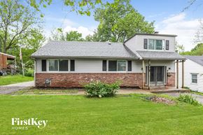 Independence house for rent - A house with a grey roof and a brick wall is for sale.