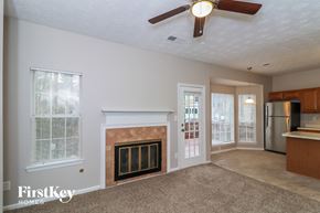 Duluth house for rent - a living room with a fireplace and a kitchen