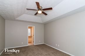 Duluth house for rent - the master bedroom has a ceiling fan and gray walls