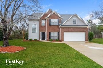 Helena house for rent - a home with a driveway and a lawn