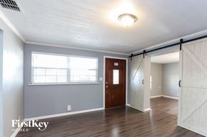 St. Petersburg house for rent - the living room of a home with a door and a window