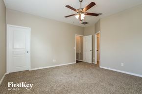 Kissimmee house for rent - the living room of a house with a ceiling fan