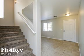 San Tan Valley house for rent - A staircase in a house with a FirstKey Homes logo.