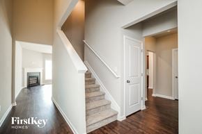 Mcdonough house for rent - a view of a staircase in a home with a fireplace