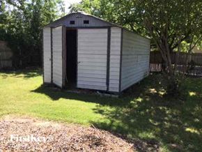 Garland house for rent - a small shed in the grass next to some trees