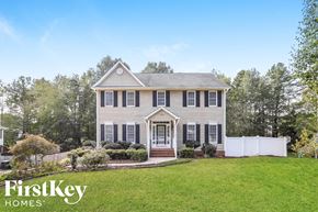 High Point house for rent - A house with a white picket fence in front.