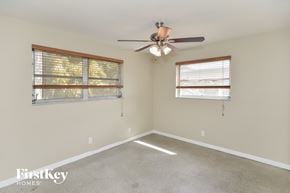 Fort Lauderdale house for rent - a living room with a ceiling fan and two windows