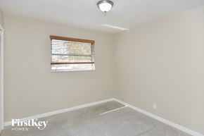 Fort Lauderdale house for rent - a bedroom with a window and a carpeted floor