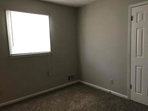 Dacula house for rent - A room with a window and a door.
